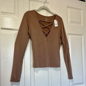 Me to We hazelnut long sleeve shirt with cross chest detail. Size M. NWT.